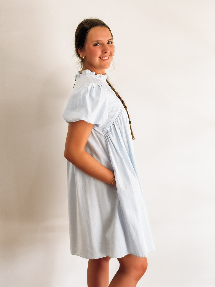 Pintuck short sleeve bubble sleeve mock neck dress.