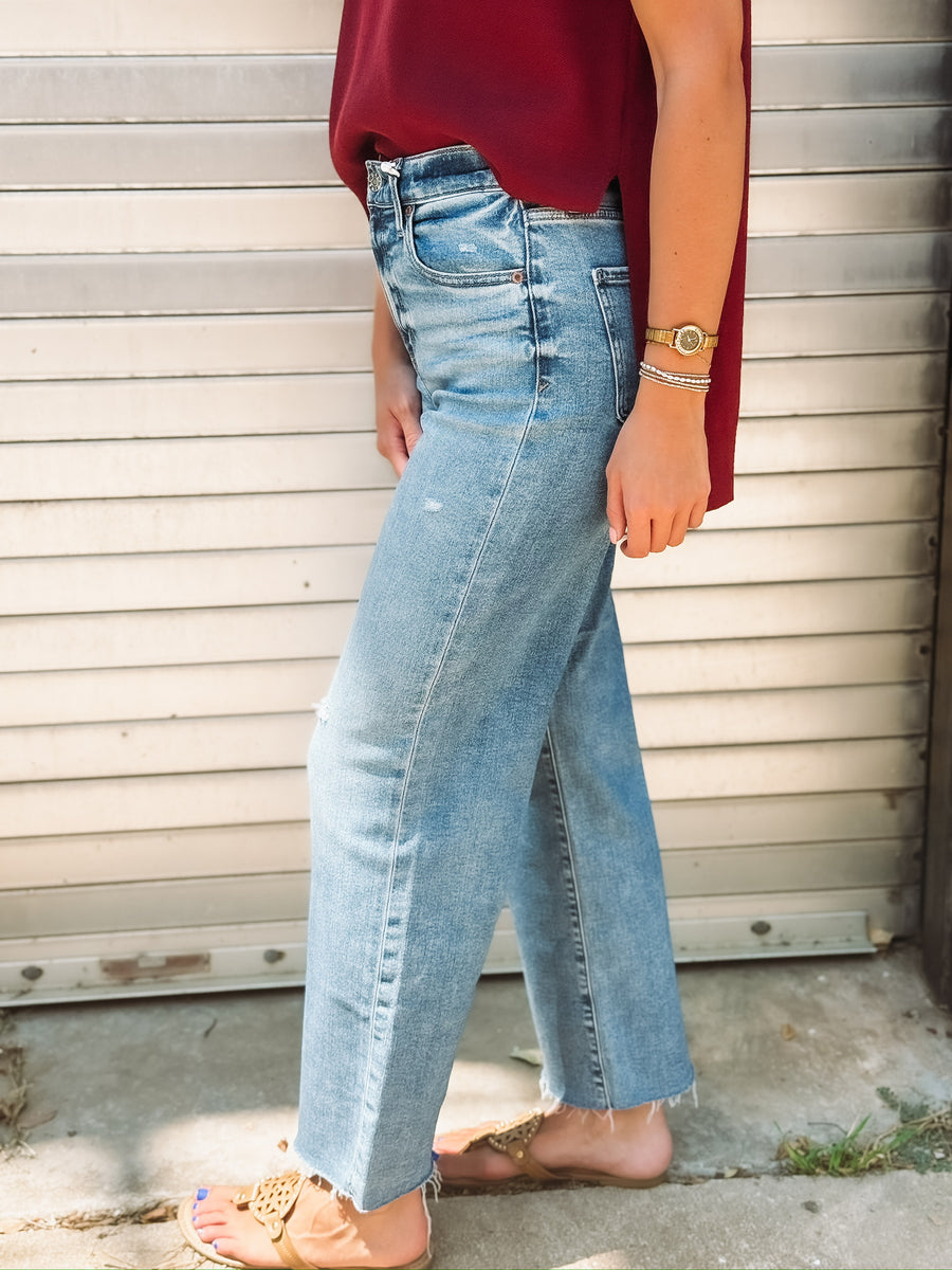 Pleaser jeans in wide awake vintage by Daze - a medium faded wash crop jean with a raw hem.