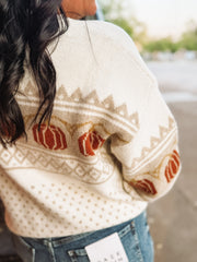 Long sleeve fairisle pumpkin detail sweater on an ivory base and cream and orange detail. 