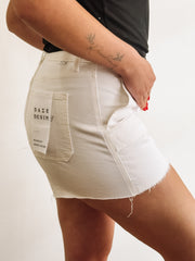 White cargo denim shorts with raw hem by Daze.
