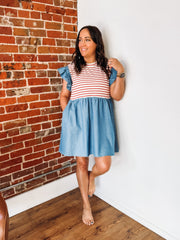 Mixed media dress with red and white stripes along the bust and a denim base with ruffle detail.