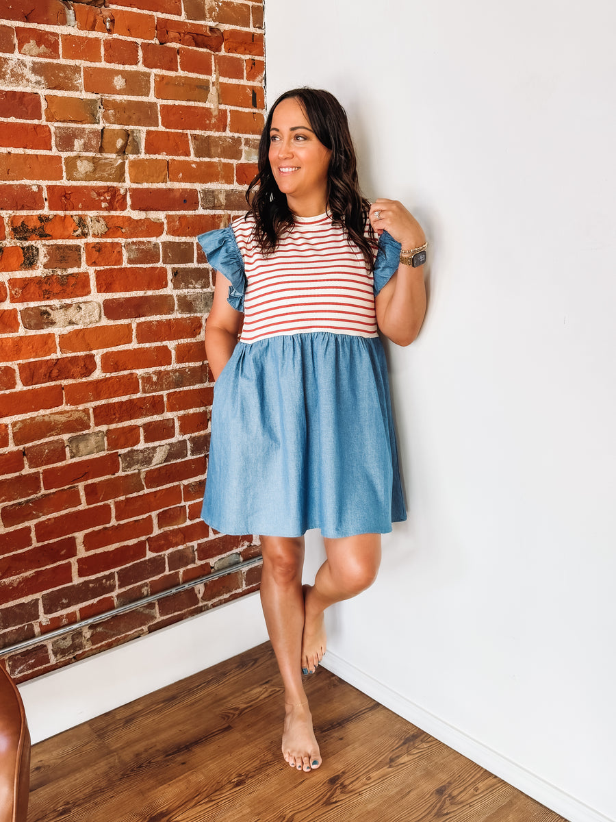 Mixed media dress with red and white stripes along the bust and a denim base with ruffle detail.