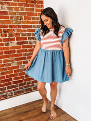 Mixed media dress with red and white stripes along the bust and a denim base with ruffle detail.