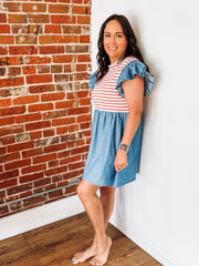 Mixed media dress with red and white stripes along the bust and a denim base with ruffle detail.