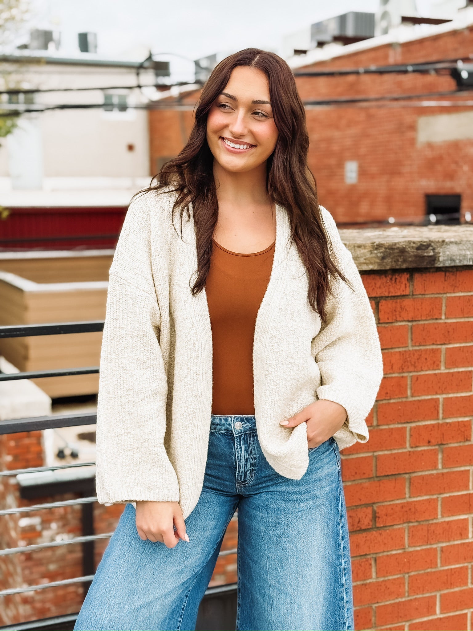 Soft, bubble-cut open-front cardigan with relaxed billowy sleeves and a cozy, refined texture.