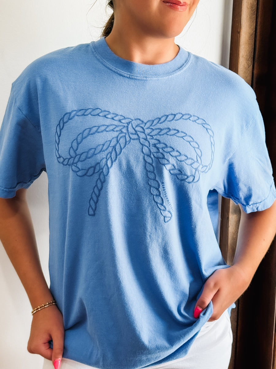 Rope bow puff print on a blue comfort colors short sleeve tee,