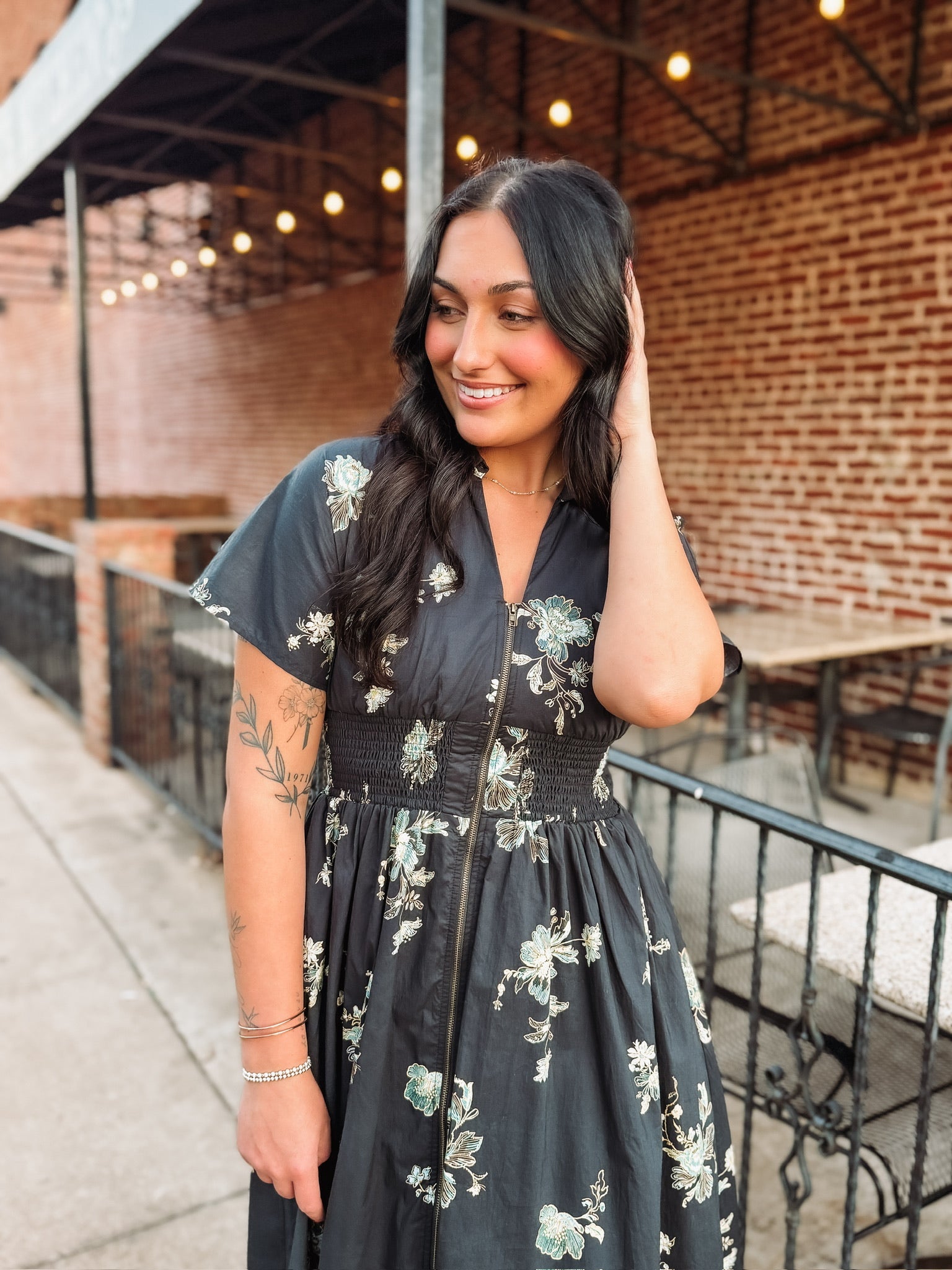 Short sleeve navy floral midi dress with v neck and zip front closure and smocked waist.