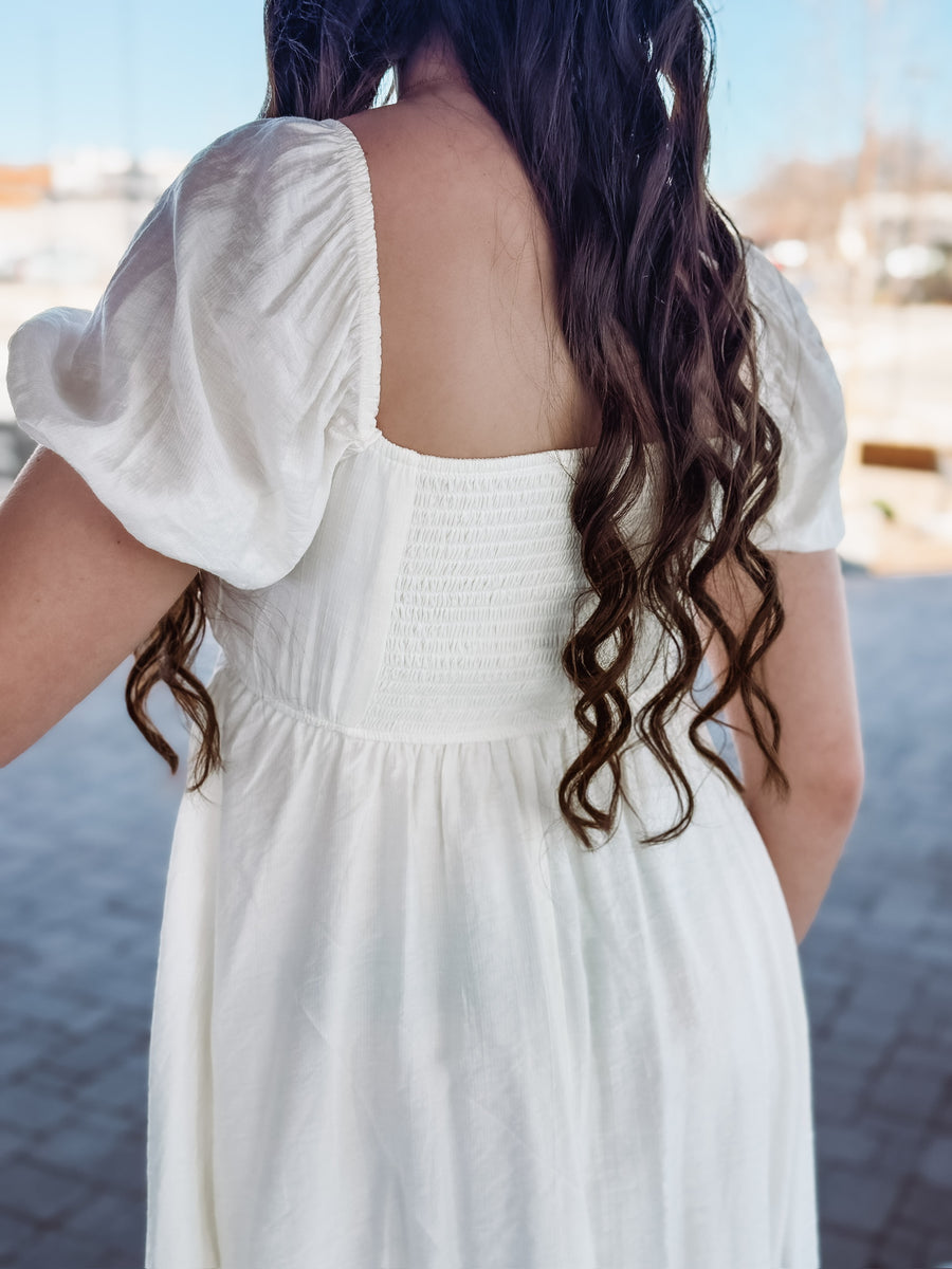 Ivory short sleeve pleated bodice with smocked backing mini dress.