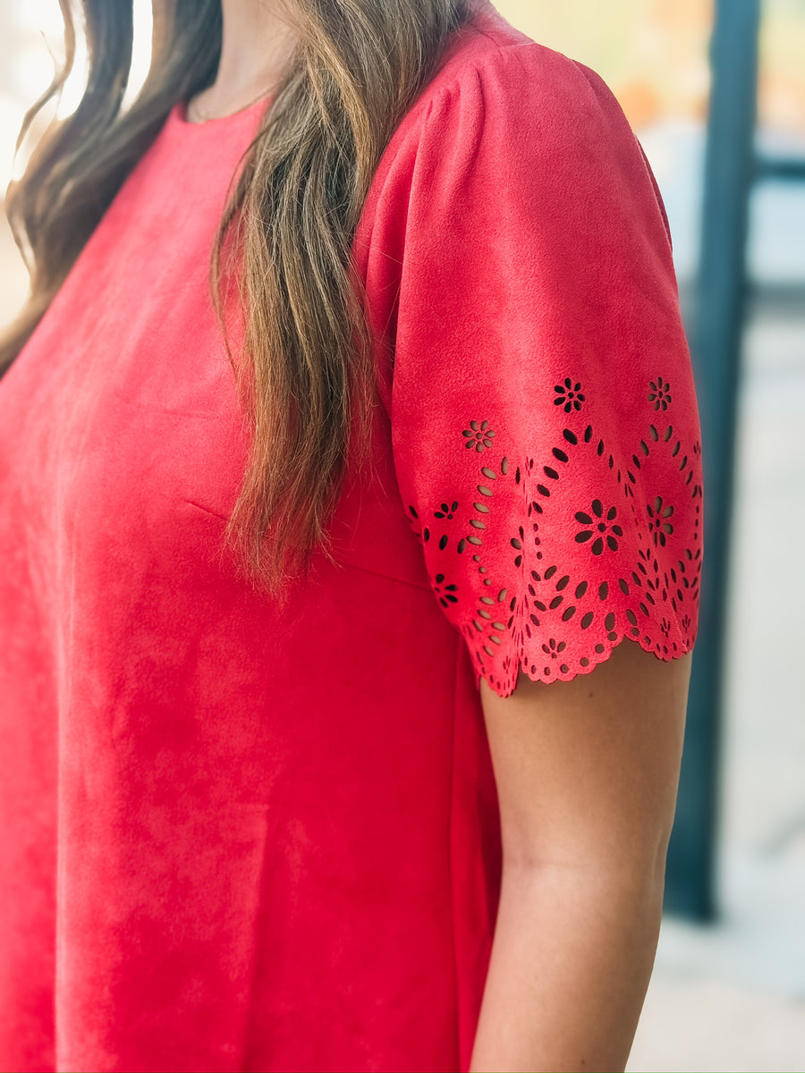Tomato red short sleeve mini dress with eyelet detailing on the hem and sleeves. 