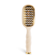 Hairbrush with gold bristle head and tan handle 