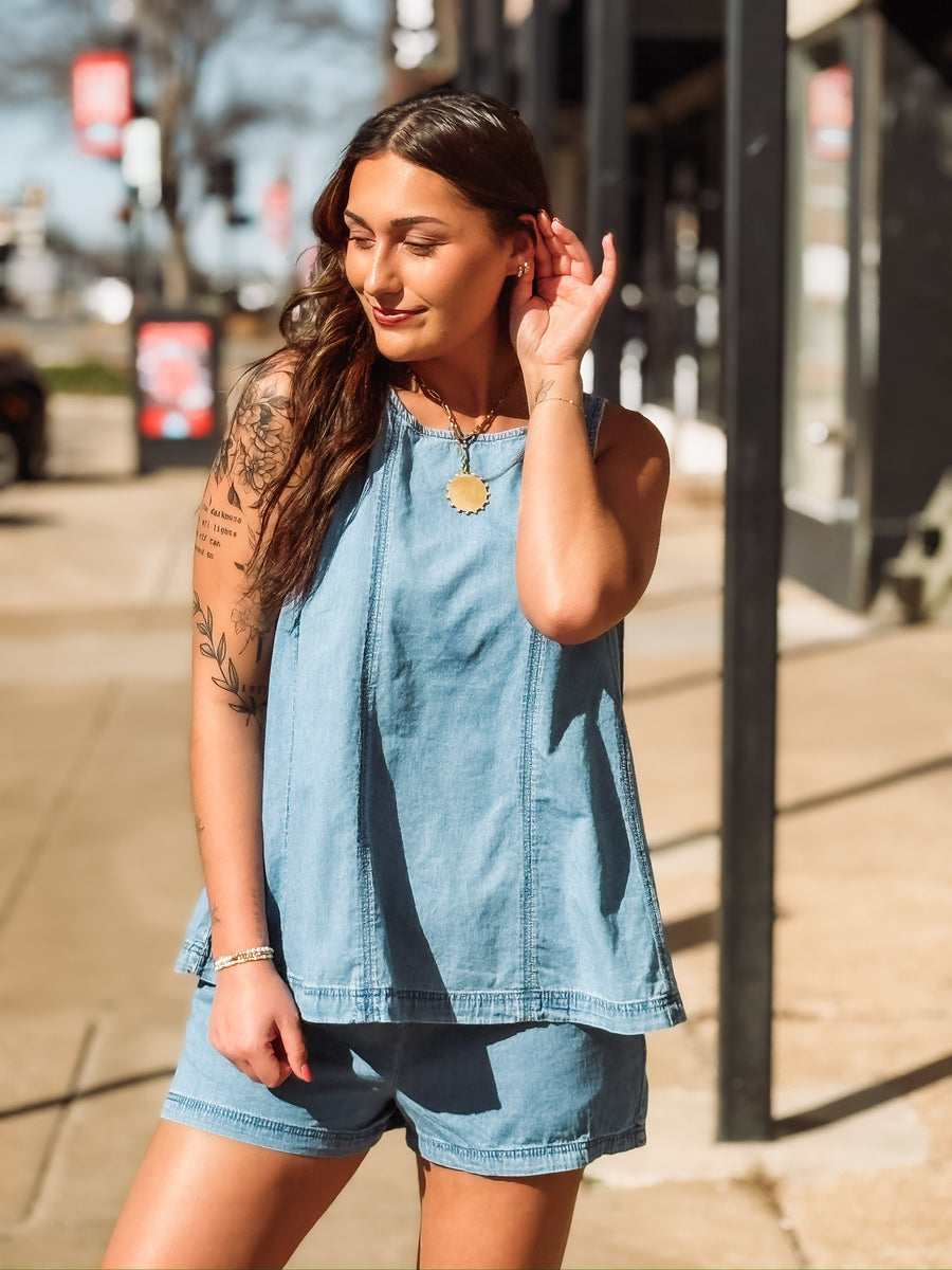 Two piece denim short set with high neck tank top.