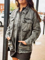 Black washed denim  anorak jacket with aztec print, a zipper and snap button front.