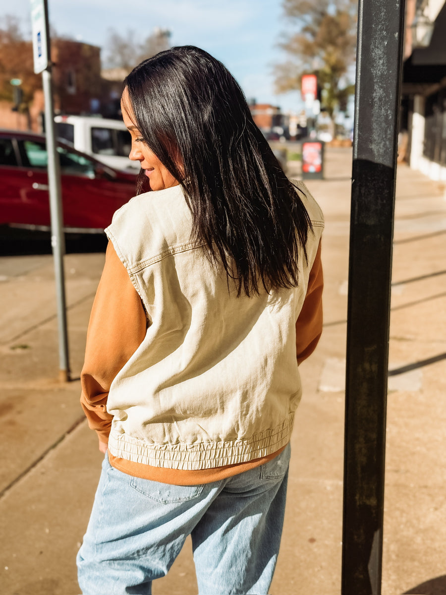 Washed oversized denim oat colored zip up vest.