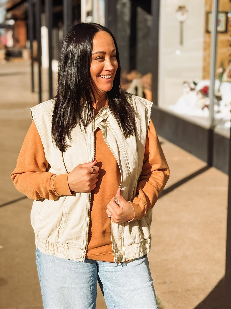 Washed oversized denim oat colored zip up vest.