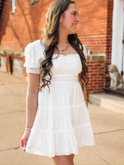 White tiered ruffle short smocked sleeve and back mini dress.