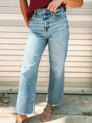 Pleaser jeans in wide awake vintage by Daze - a medium faded wash crop jean with a raw hem.