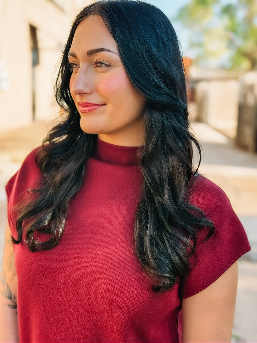 Wine colored short sleeve mock neck mini  dress in a sweater material.