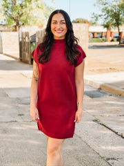 Wine colored short sleeve mock neck mini  dress in a sweater material.