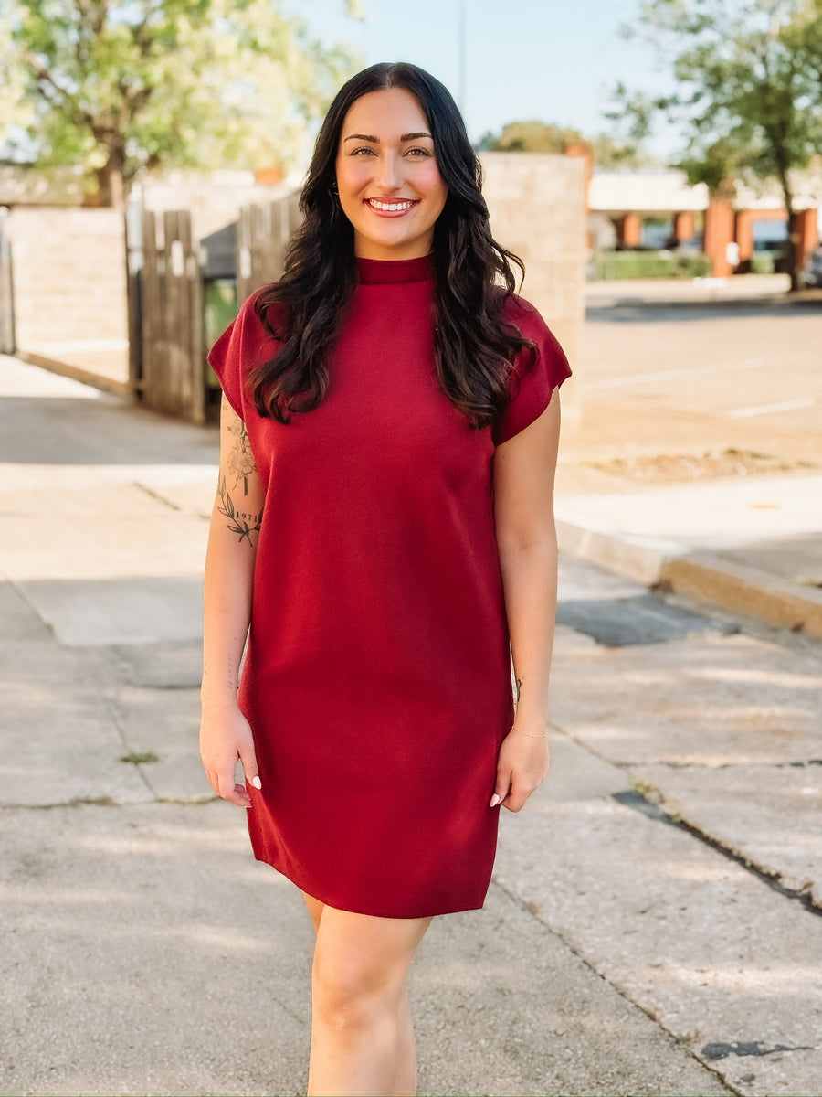 Wine colored short sleeve mock neck mini  dress in a sweater material.