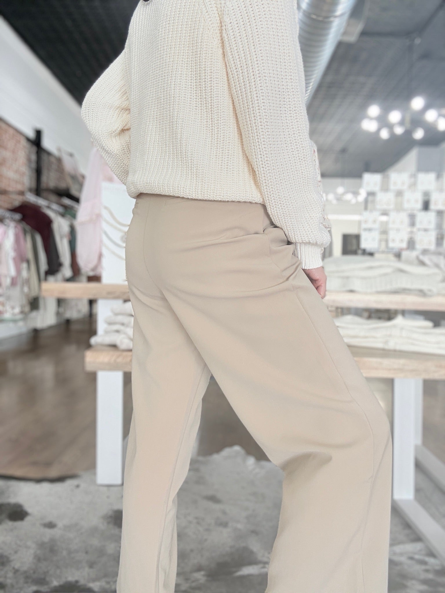 Womens pleated cropped trouser pants with front pockets and faux dress pant pockets on the back.