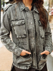 Black washed denim  anorak jacket with aztec print, a zipper and snap button front.