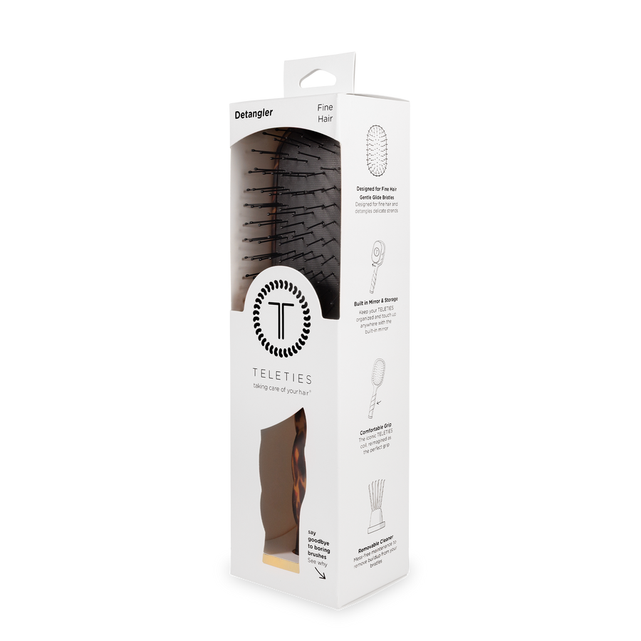 Teleties detangler packaging with product image on a white background