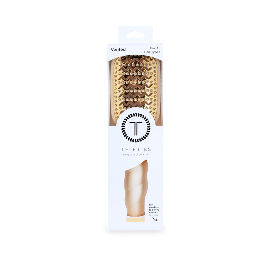 Packaged hairbrush with Teleties branding on a white background