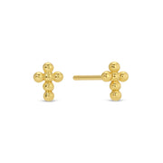 Gold cross-shaped earrings on a white background