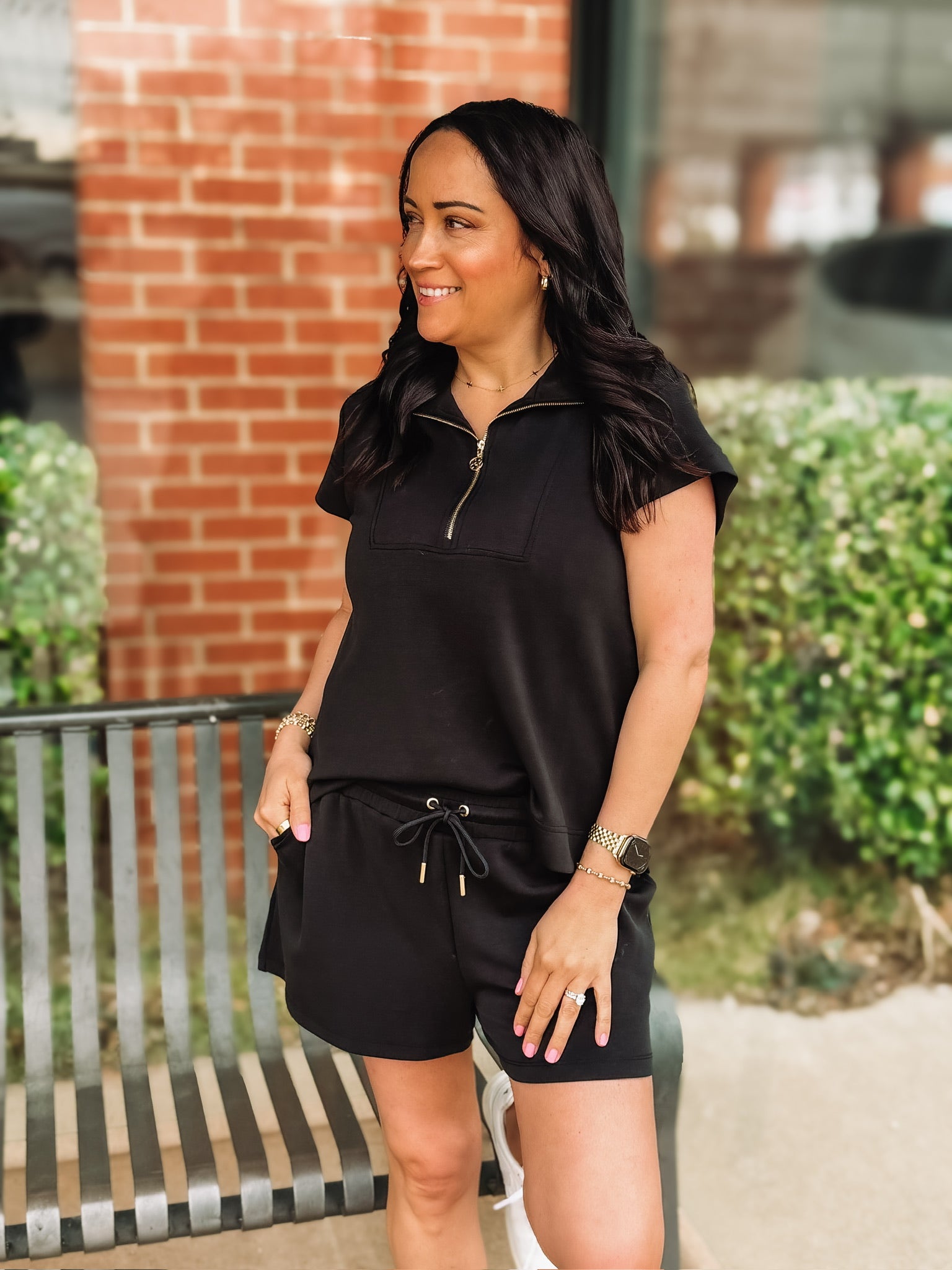 Black short sleeve scuba short set with gold sipper and end cap details from Mary Square.