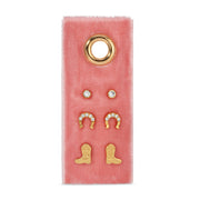 Set of gold earrings on a pink velvet card with a gold ring design.
