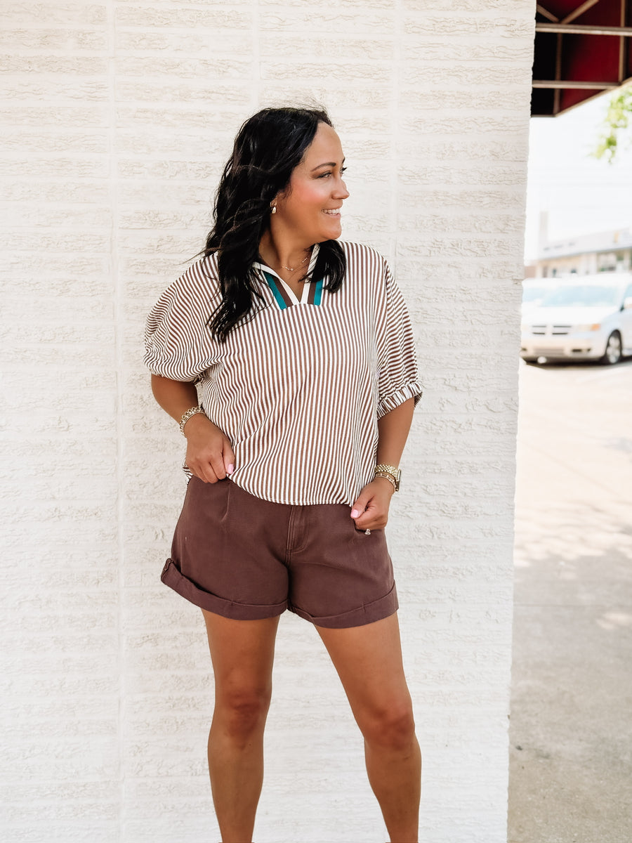 brown and white striped short sleeve dolman top with a v neck line and contrast seaming.