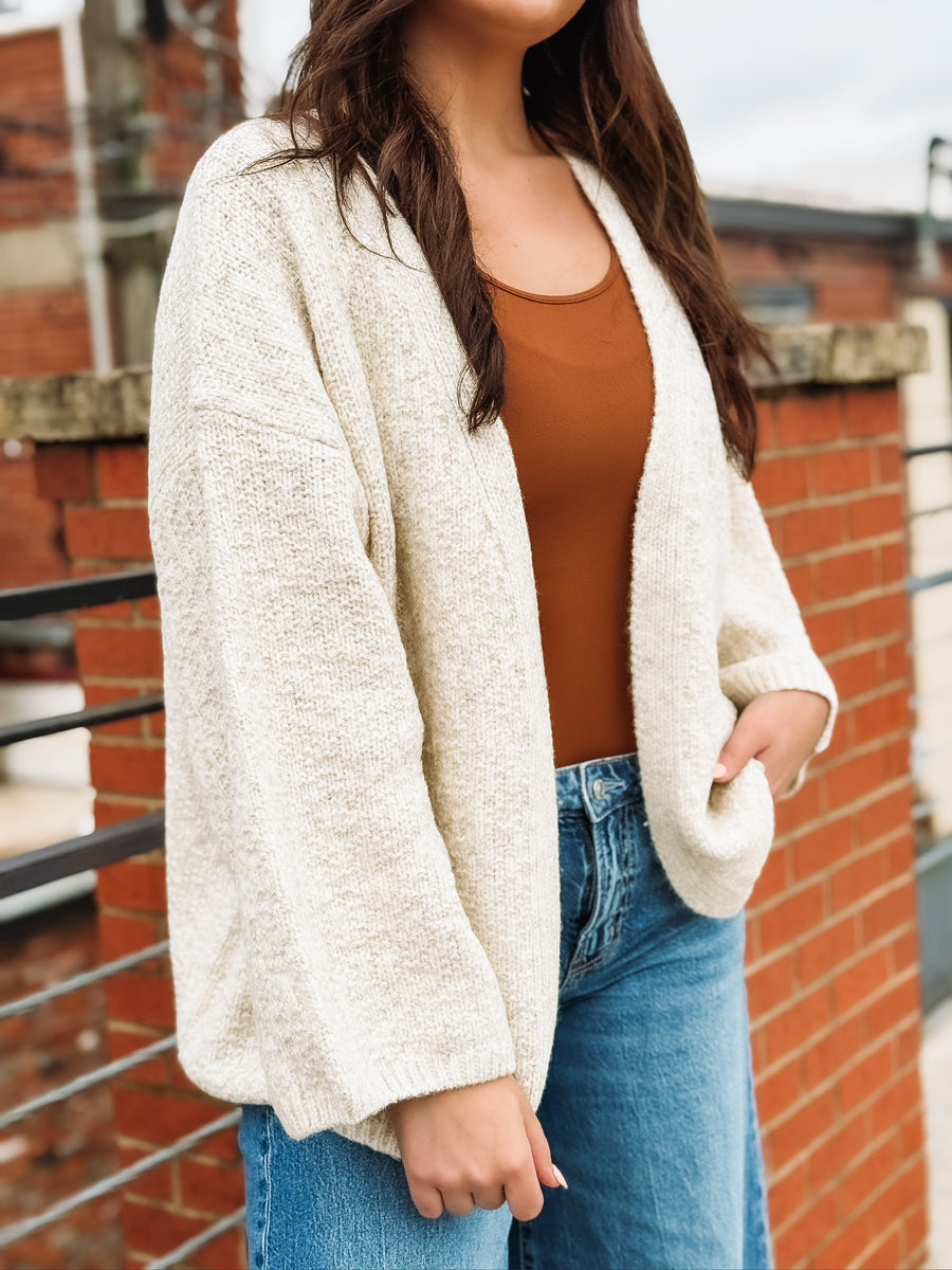 Soft, bubble-cut open-front cardigan with relaxed billowy sleeves and a cozy, refined texture.