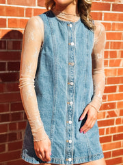 Sleeveless light wash button up denim dress.