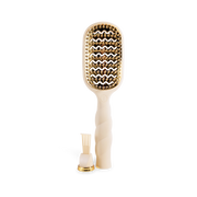 Hairbrush with gold bristle head and white handle on a white background