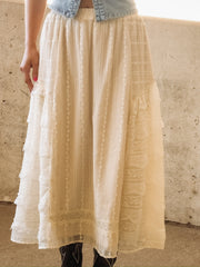 Feminine cream lace skirt featuring delicate embroidery and layered ruffles
