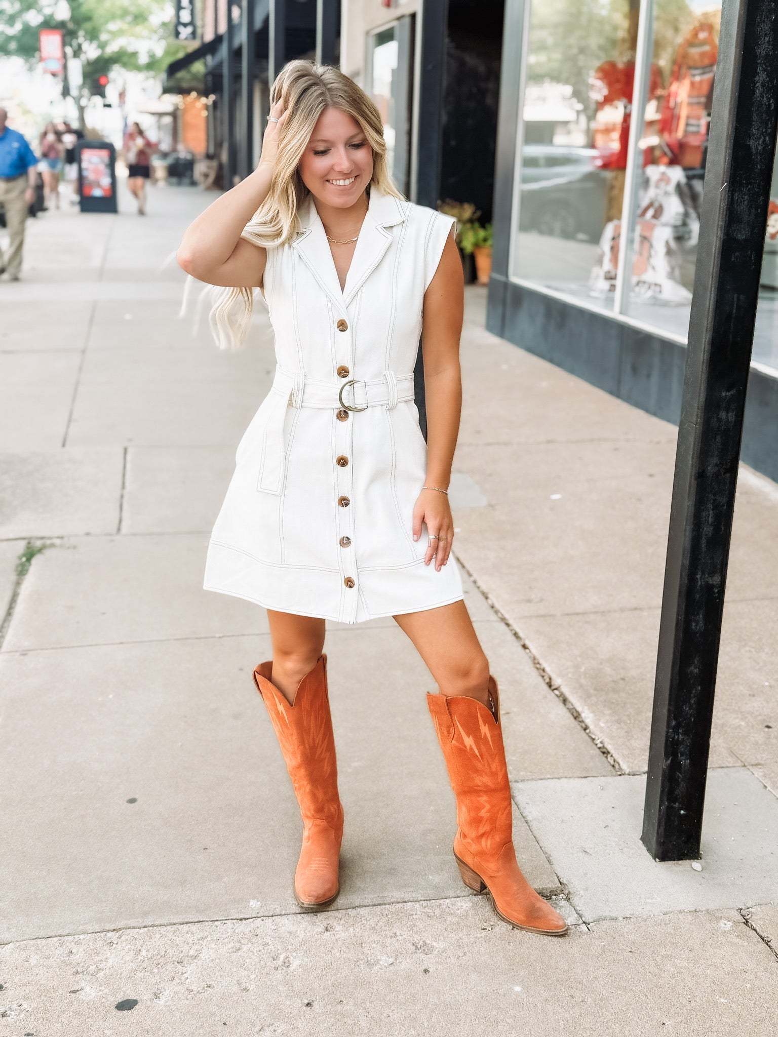 Cream button up sleeveless denim mini dress with d ring belt detail.