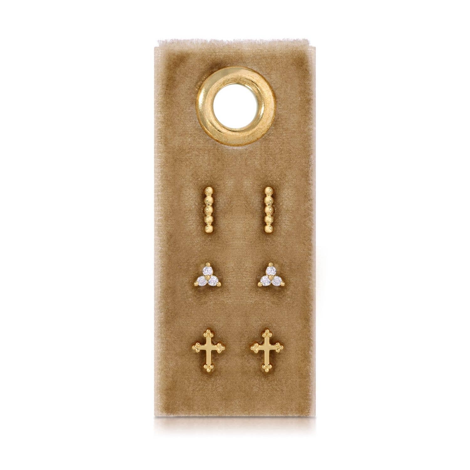 Set of gold and paveearrings on a brown velvet card with a gold ring on a white background