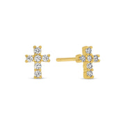 Gold cross-shaped earrings with clear gemstones on a white background