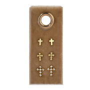 Set of gold cross earrings on a brown card with a gold ring.