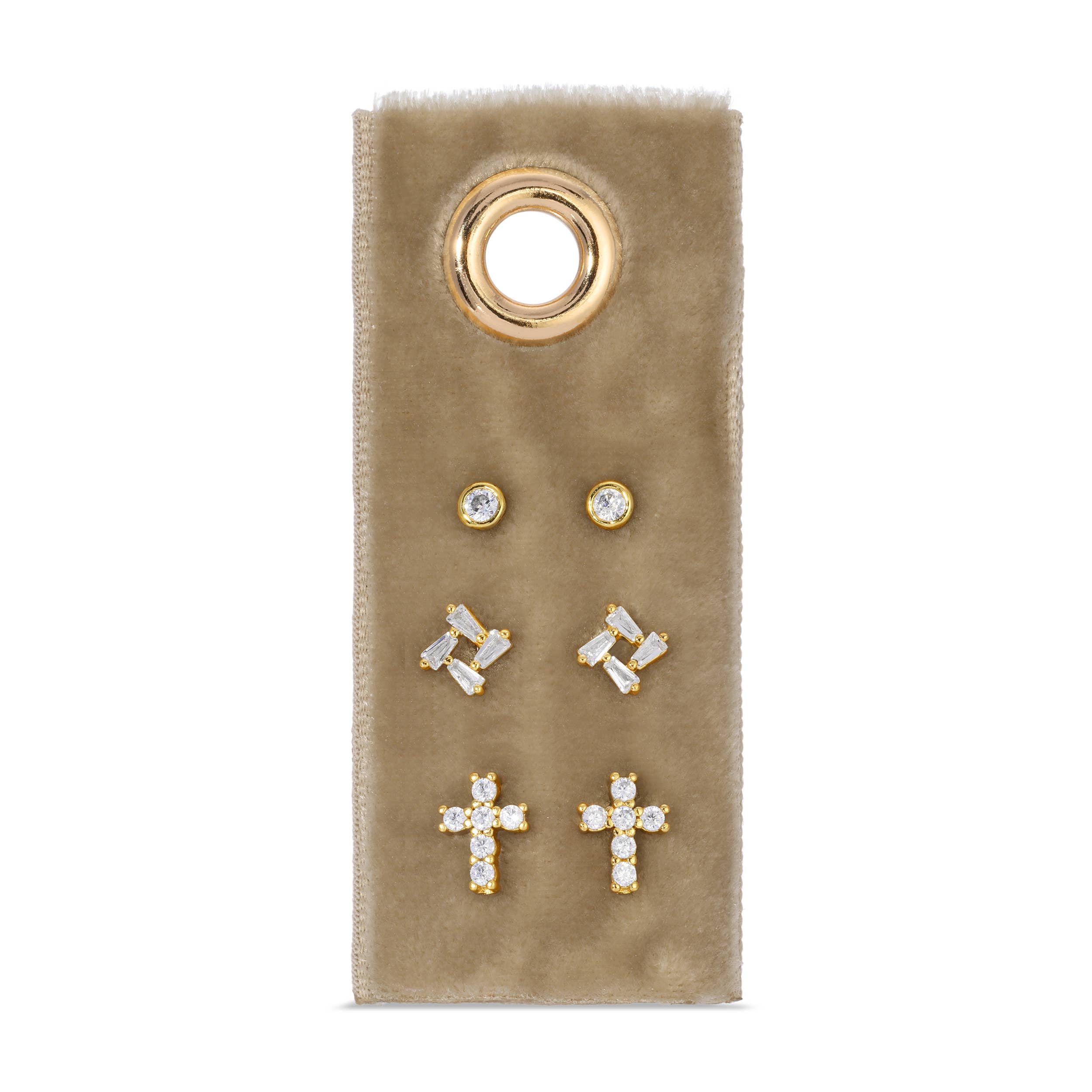 Set of gold and crystal earrings on a beige card with a gold ring design.