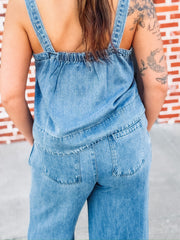 Sleeveless denim top paired with matching wide leg trouser in a relaxed two piece outfit.