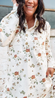 Long sleeve cream denim button up mini  dress with olive and rust florals.