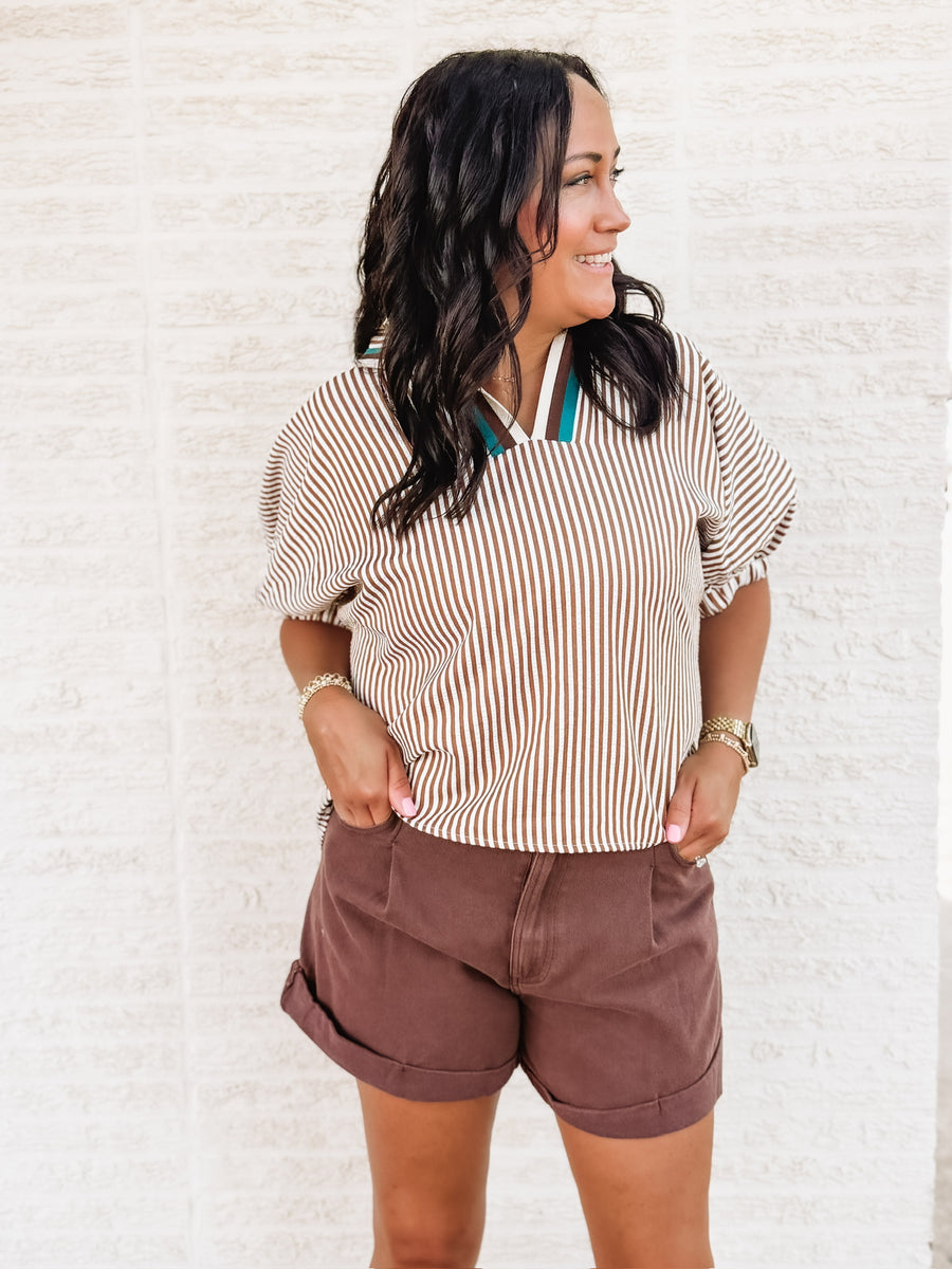 brown and white striped short sleeve dolman top with a v neck line and contrast seaming.