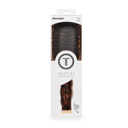 Hair detangler with packaging displaying 'Teleties' brand on a white background