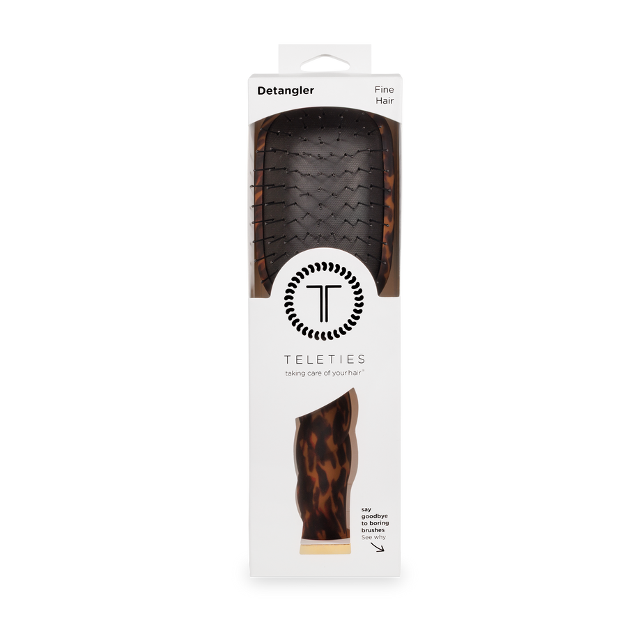 Hair detangler with packaging displaying 'Teleties' brand on a white background