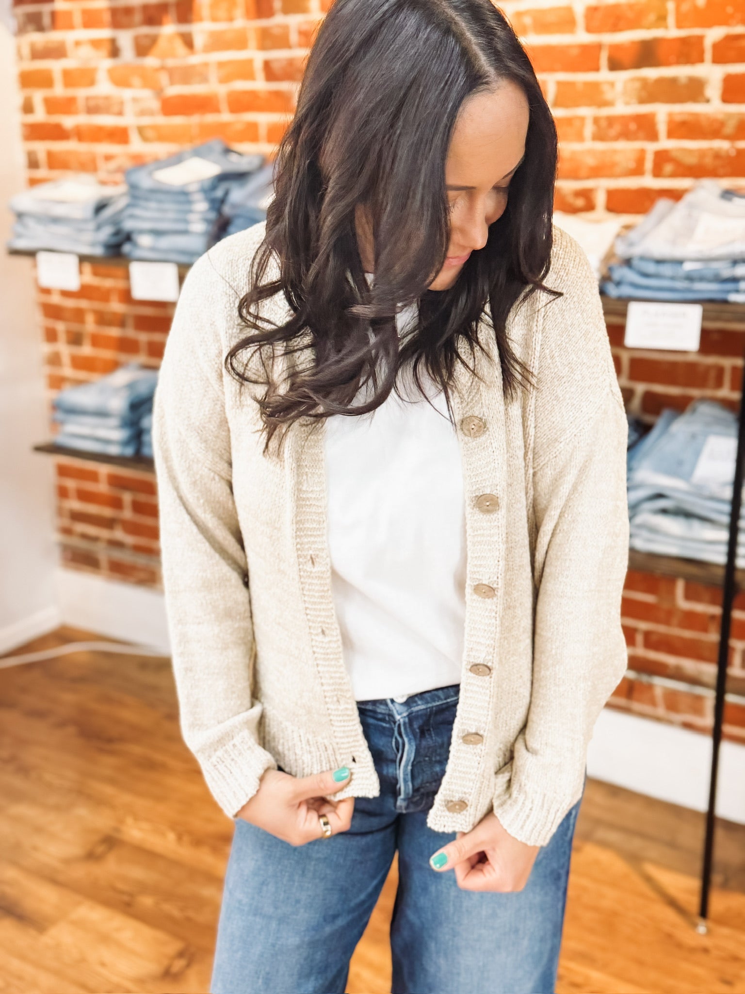 Ecru button up long sleeve cardigan with wooden detailed buttons.
