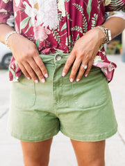 Green high-rise shorts with front pockets