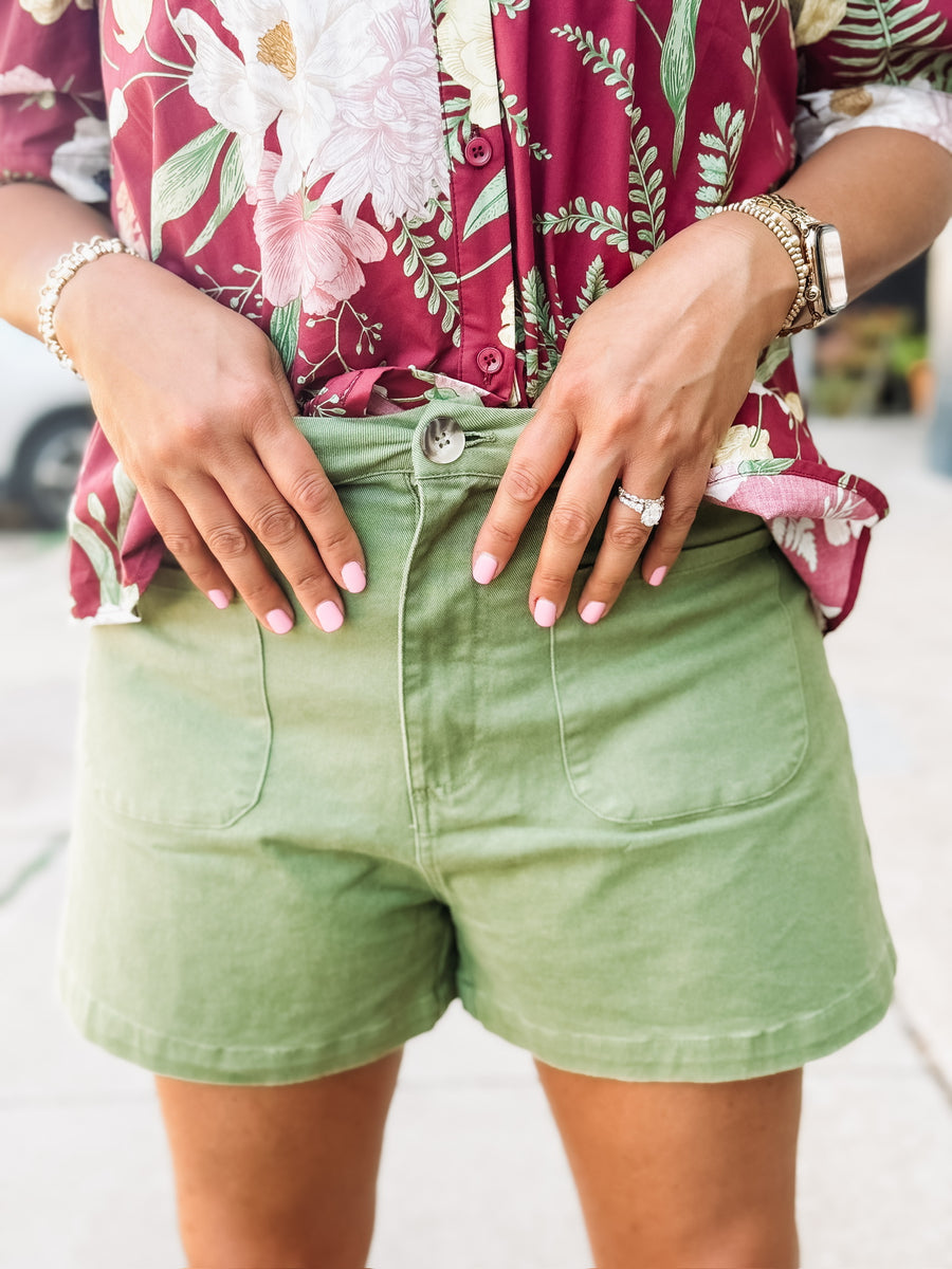 Green high-rise shorts with front pockets