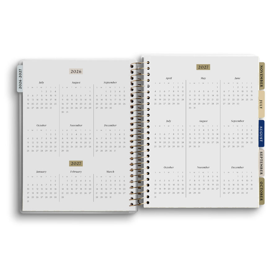 Open spiral-bound planner showing calendar pages from 2021 to 2023 on a white background.