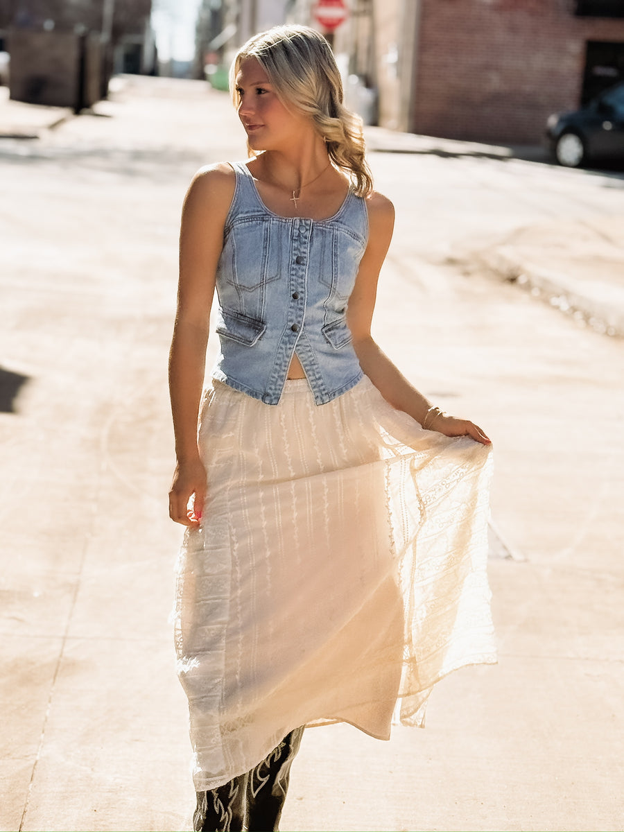 Feminine cream lace skirt featuring delicate embroidery and layered ruffles